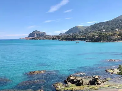 a view of the ocean with mountains in the background at Villa Jancaliva by Interhome in Cefalù