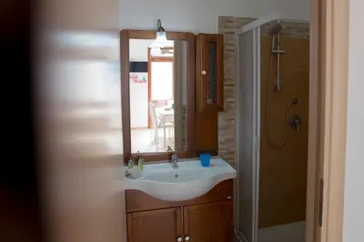 a bathroom with a sink and a mirror at Villa Maria in San Vito lo Capo