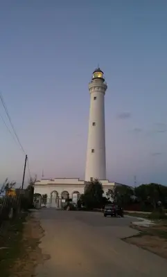 a lighthouse sitting on top of a building at Villa I Due Pini in San Vito lo Capo