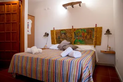 a bedroom with a bed with towels on it at Villa I Due Pini in San Vito lo Capo