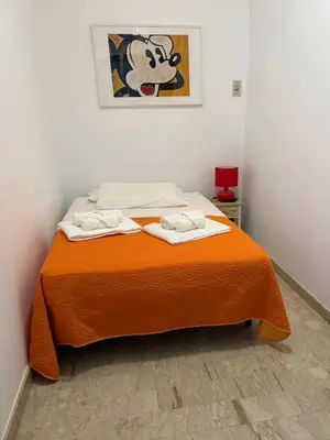 a bedroom with a bed with two towels on it at Casa Vacanza Mare in Castellammare del Golfo