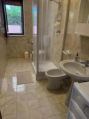 a bathroom with a shower and a toilet and a sink at Casa Vacanza Mare in Castellammare del Golfo