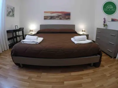 a bedroom with a bed with two towels on it at La Casetta in Palermo