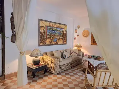 a living room with a couch and a table at Casa Perciata - Locazione Turistica in Mondello