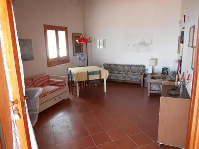 a living room with a couch and a table at Casa Vacanze La Terrazza Sul Golfo in Castellammare del Golfo
