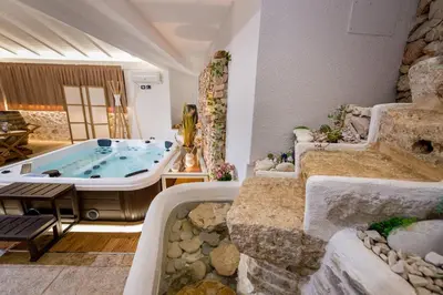 a large bathroom with a jacuzzi tub and stairs at Villa esclusiva Milazzo Annarita in Castellammare del Golfo
