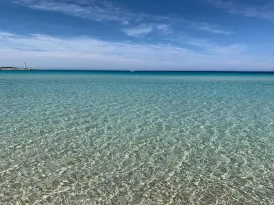 a large body of water with crystal clear water at Coralia Bed & Breakfast in San Vito lo Capo