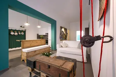 a living room with a couch and a table at Cassari UpArtments in Palermo