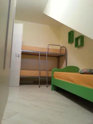 a room with two bunk beds in a room at Villa Iris in Castellammare del Golfo