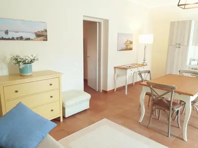 a bedroom with a desk and a table with a chair at Baglio San Giovanni in Palermo