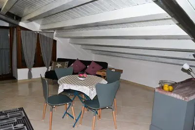 a dining room with a table and chairs at Appartamento Delle Pergole in Palermo