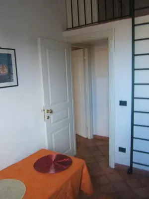 a room with a table with a hat on it at Olivella Suite Ecological House in Palermo