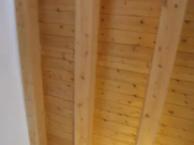 a wooden ceiling in a room with wooden walls at Olivella Suite Ecological House in Palermo