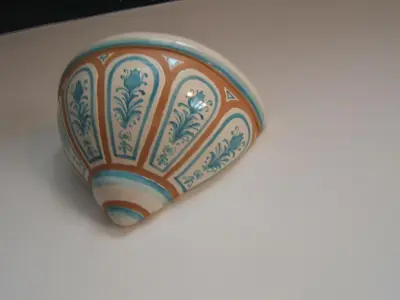 an orange and white vase sitting on a table at Olivella Suite Ecological House in Palermo