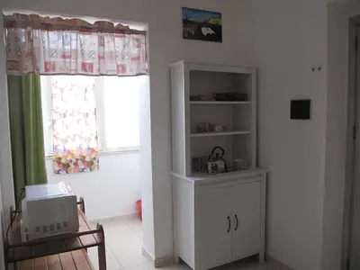a living room with a window and a white cabinet at Casa Il Papiro TRS-IT-SIC-20280 in Palermo