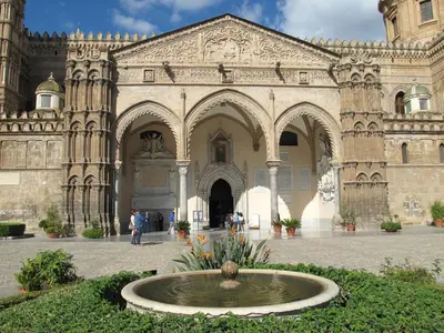 a large building with a fountain in front of it at Casa Il Papiro TRS-IT-SIC-20280 in Palermo