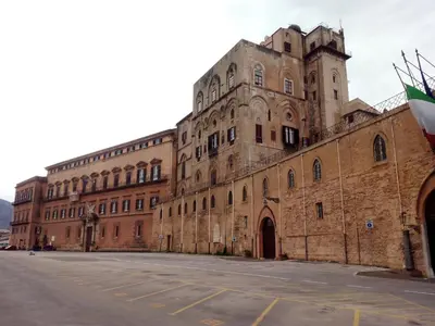 a large brick building with a street in front of it at Casa Il Papiro TRS-IT-SIC-20280 in Palermo