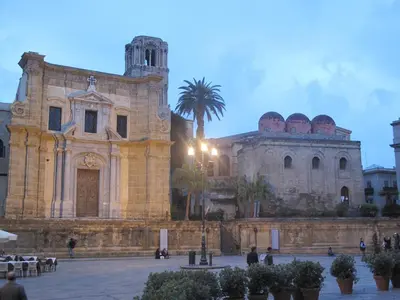 an old building with a palm tree in front of it at Casa Il Papiro TRS-IT-SIC-20280 in Palermo