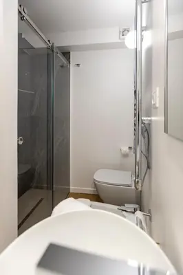 a bathroom with a shower and a toilet at Vespri Apartments in Palermo