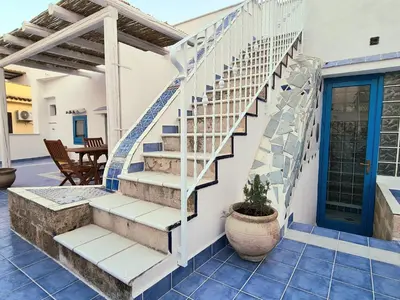a staircase in a house with a patio at casa sul mare in Terrasini