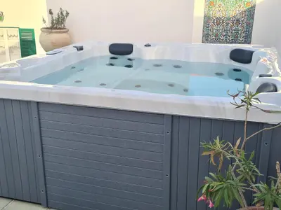 a jacuzzi tub in the middle of a room at casa sul mare in Terrasini
