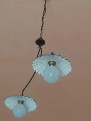 a chandelier with two lights hanging from a ceiling at Segesta Antichi Sapori in Calatafimi