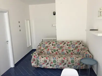 a small room with a bed and a table at Casa Vacanze Playa 54 in Castellammare del Golfo