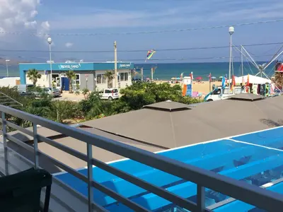 a view of the beach from the balcony of a resort at Casa Vacanze Playa 54 in Castellammare del Golfo