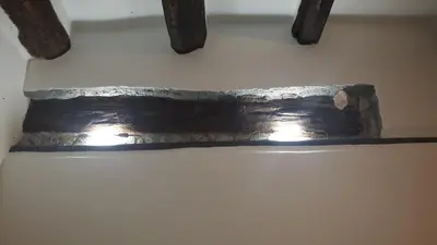 a piece of metal on a wall with two beams at Bahalara Alloggio in Palermo