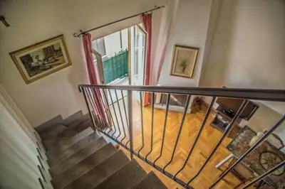 a spiral staircase in a house with a door at Palazzo Trinacria in Palermo
