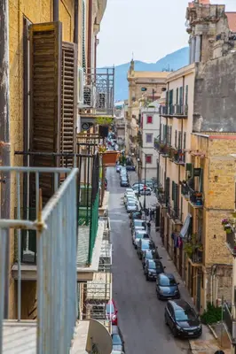 a view of a city street with parked cars at Palazzo Trinacria in Palermo
