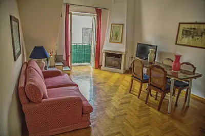 a living room with a couch and a table at Palazzo Trinacria in Palermo