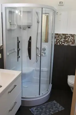a bathroom with a shower with a sink and a toilet at Mare Sole Relax in Castellammare del Golfo