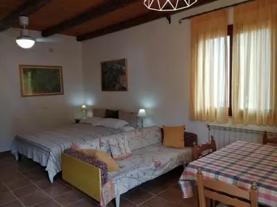 a kitchen with a counter with tiles on the wall at Agriturismo Finazzo in Balata di Baida