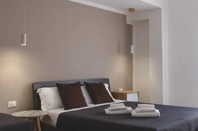 a bedroom with a bed with towels on it at La Meridiana in Castellammare del Golfo