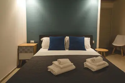 a bedroom with a bed with towels on it at La Meridiana in Castellammare del Golfo