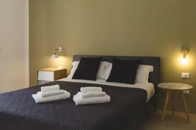 a bedroom with a bed with towels on it at La Meridiana in Castellammare del Golfo