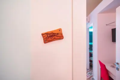 a sign on the side of a white refrigerator at B&B L'Orlando Furioso in Palermo