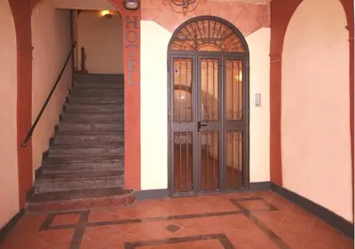 an entrance to a building with a door and stairs at Hotel Cortese in Palermo