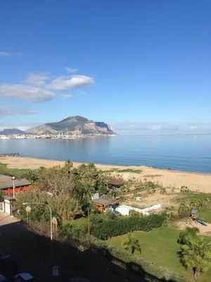 a view of a beach and the ocean at Palazzo Scavone in Palermo
