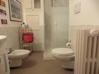a bathroom with a toilet and a sink and a shower at Bobnb in Palermo