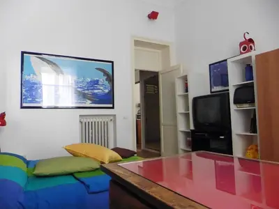 a living room with a couch and a tv at Bobnb in Palermo