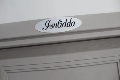 a close up of a door with the word julilda on it at Monte Monaco B&B in San Vito lo Capo