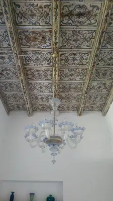 a ceiling with a chandelier in a room at Piazza Marina Chic in Palermo