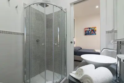 a bathroom with a shower and a sink at Pharos in San Vito lo Capo