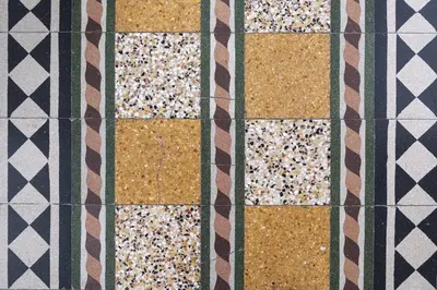 a close up of a quilt with different colored squares at Le case di Frelli in Palermo