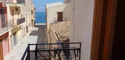 a view of a street from a balcony of a building at Appartamenti Blu Mare in Castellammare del Golfo