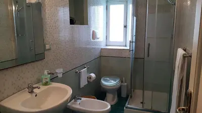 a bathroom with a sink and a toilet and a shower at Profumo di Sicilia in Palermo