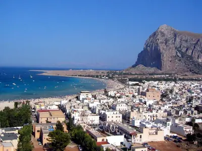 a city with a mountain in the background at Case nel Giardino in San Vito lo Capo
