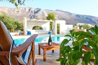 a swimming pool in front of a villa at night at Villa Le Sterlizie in Castellammare del Golfo